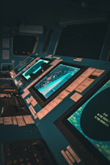Security specialist monitoring multiple screens displaying cybersecurity data.