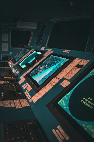 A team of experts analyzing disaster data on multiple screens in a modern control room.