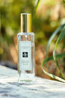 a bottle of cologne sitting on top of a table