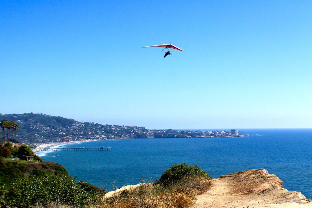 a kite flying over a body of water