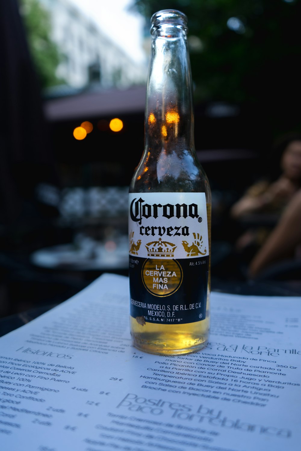 a bottle of corona beer sitting on top of a table
