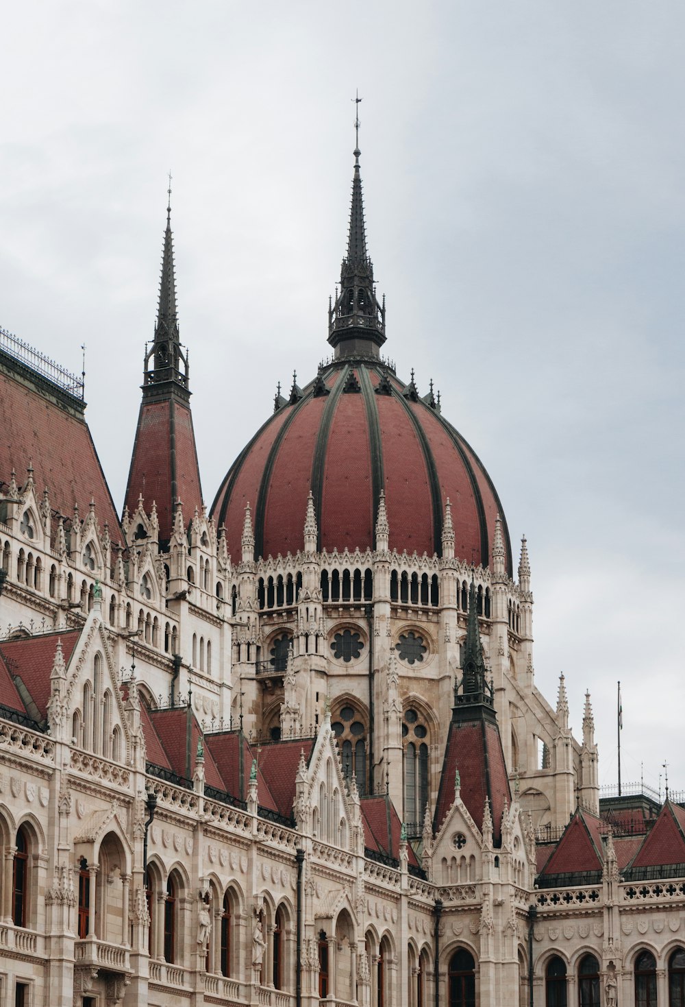 a large building with a red dome on top of it