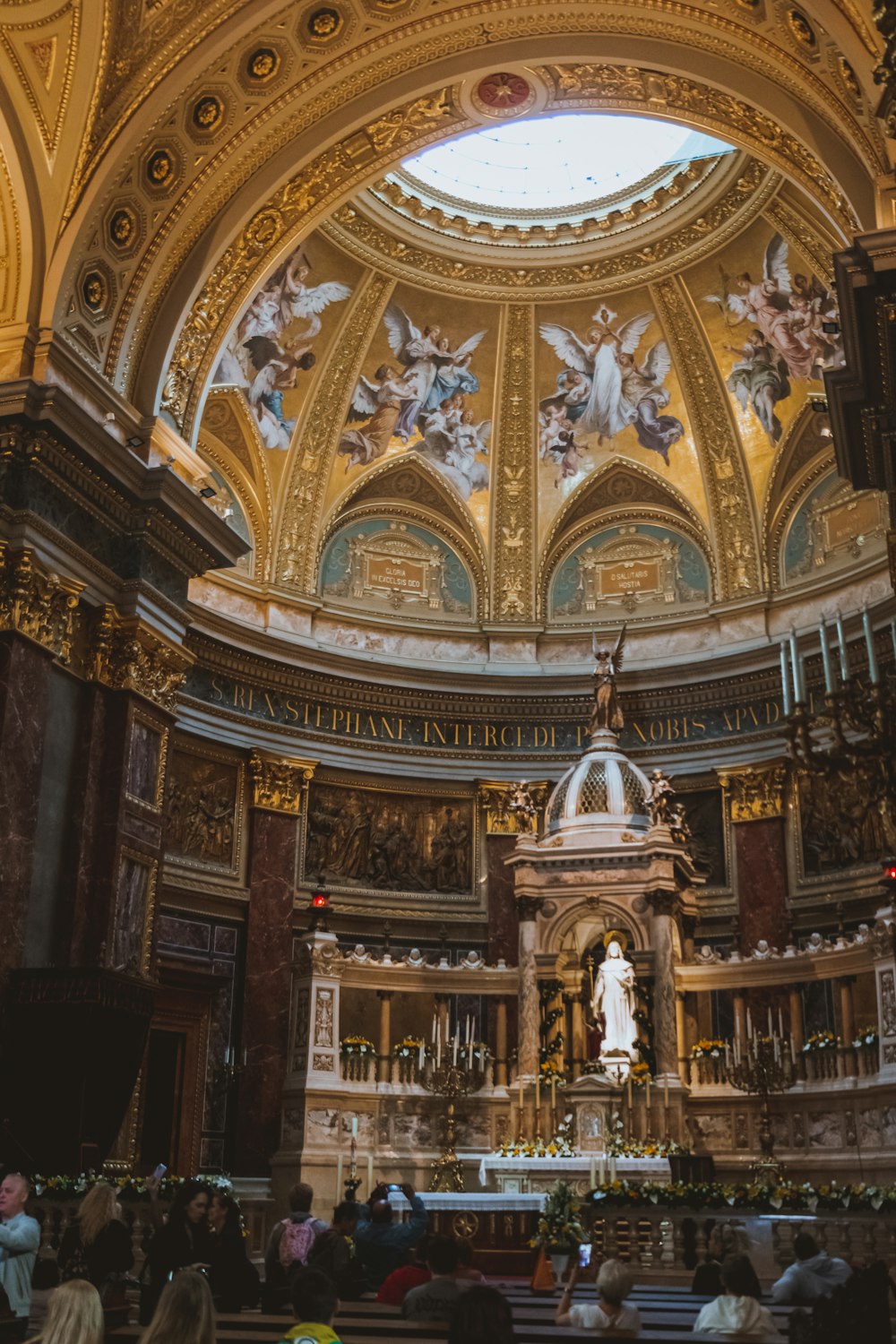 a church with a dome and a statue in the center