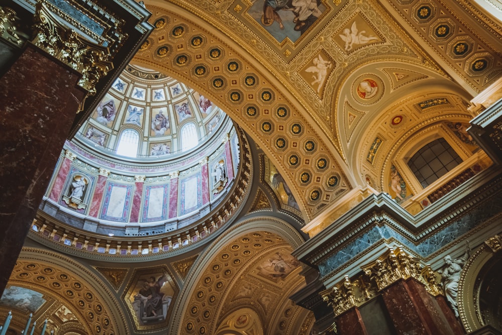 the ceiling of a church with a dome above it