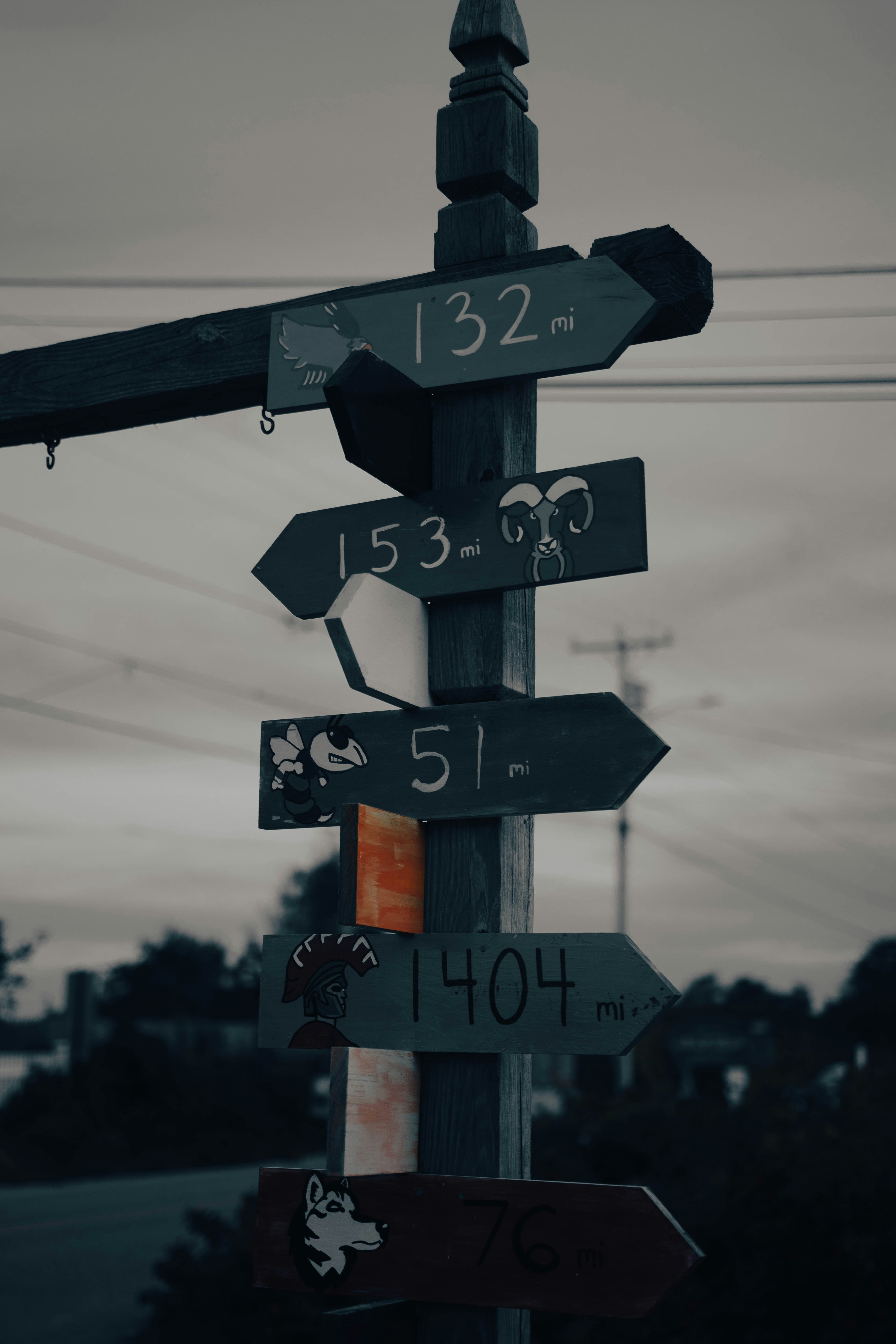 a pole with a bunch of street signs on it