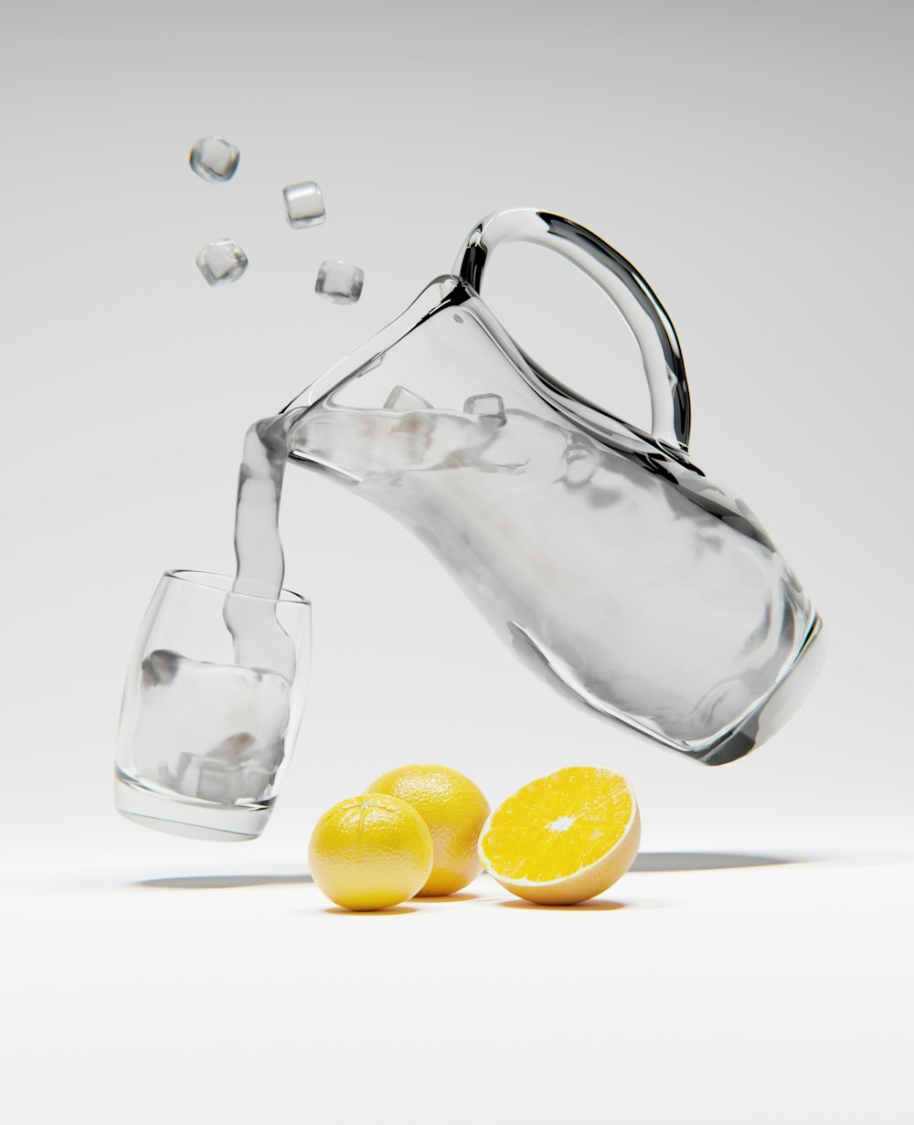 a pitcher pouring water into a glass filled with lemons