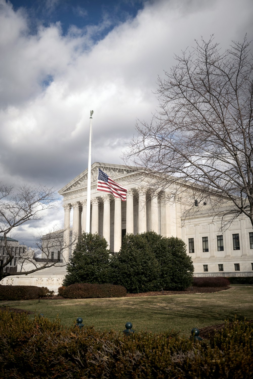 a large building with a flag on top of it