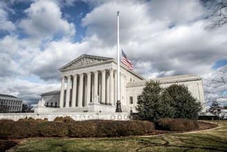 a large building with a flag on top of it