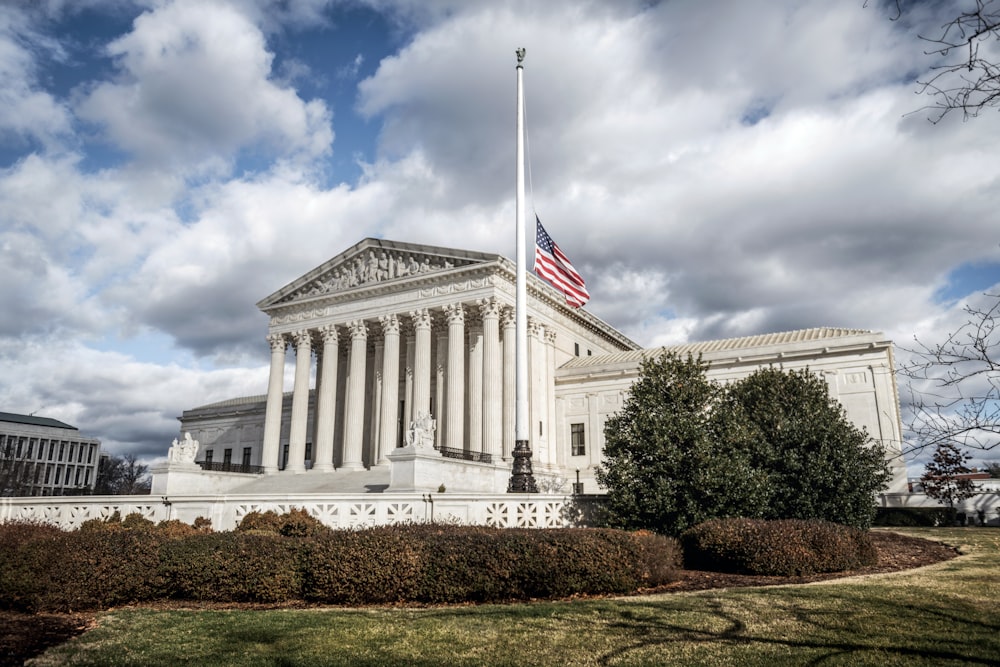 a large building with a flag on top of it