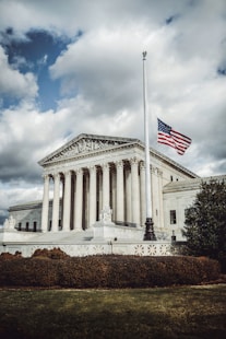 a large building with a flag on top of it