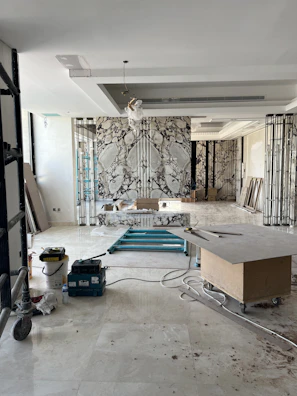 Wide shot of a retail space mid-renovation with visible civil construction elements.