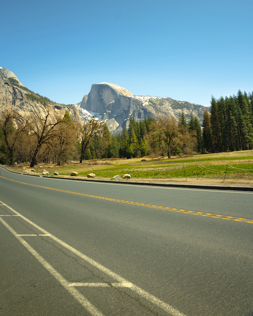 a road with a mountain in the background