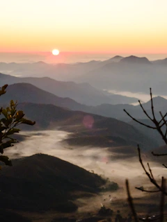 A vibrant sunrise over a peaceful mountain village, capturing the essence of early morning travel.
