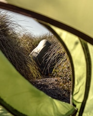 Close-up of natural textures like woven baskets and wooden accents inside the tent.