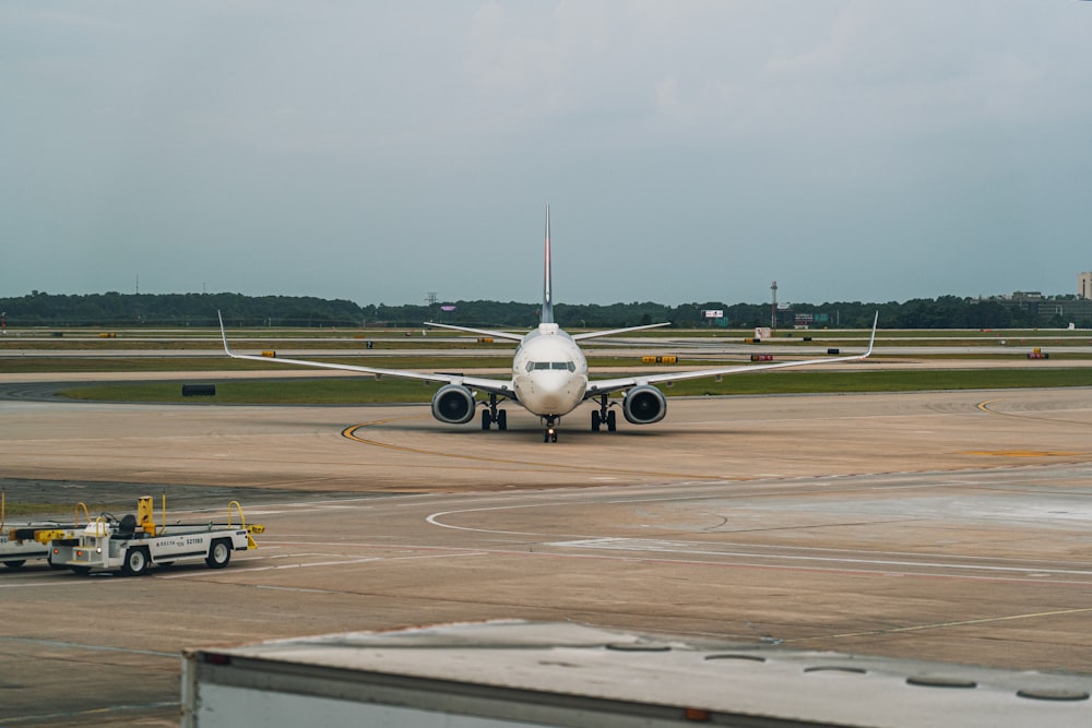 a large jetliner sitting on top of an airport tarmac