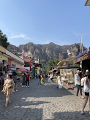 A vibrant street scene in Malalcahuello with local shops and visitors enjoying the mountain village atmosphere.