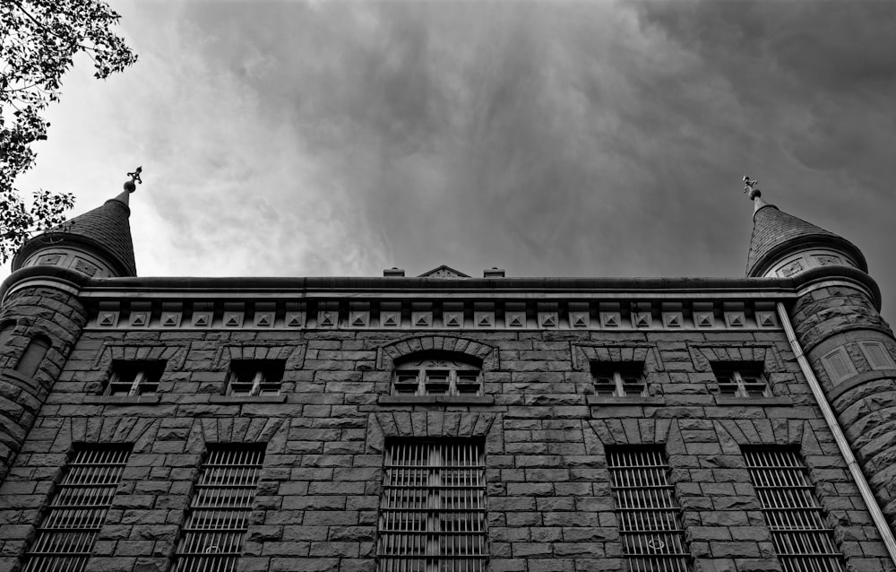 a black and white photo of a brick building