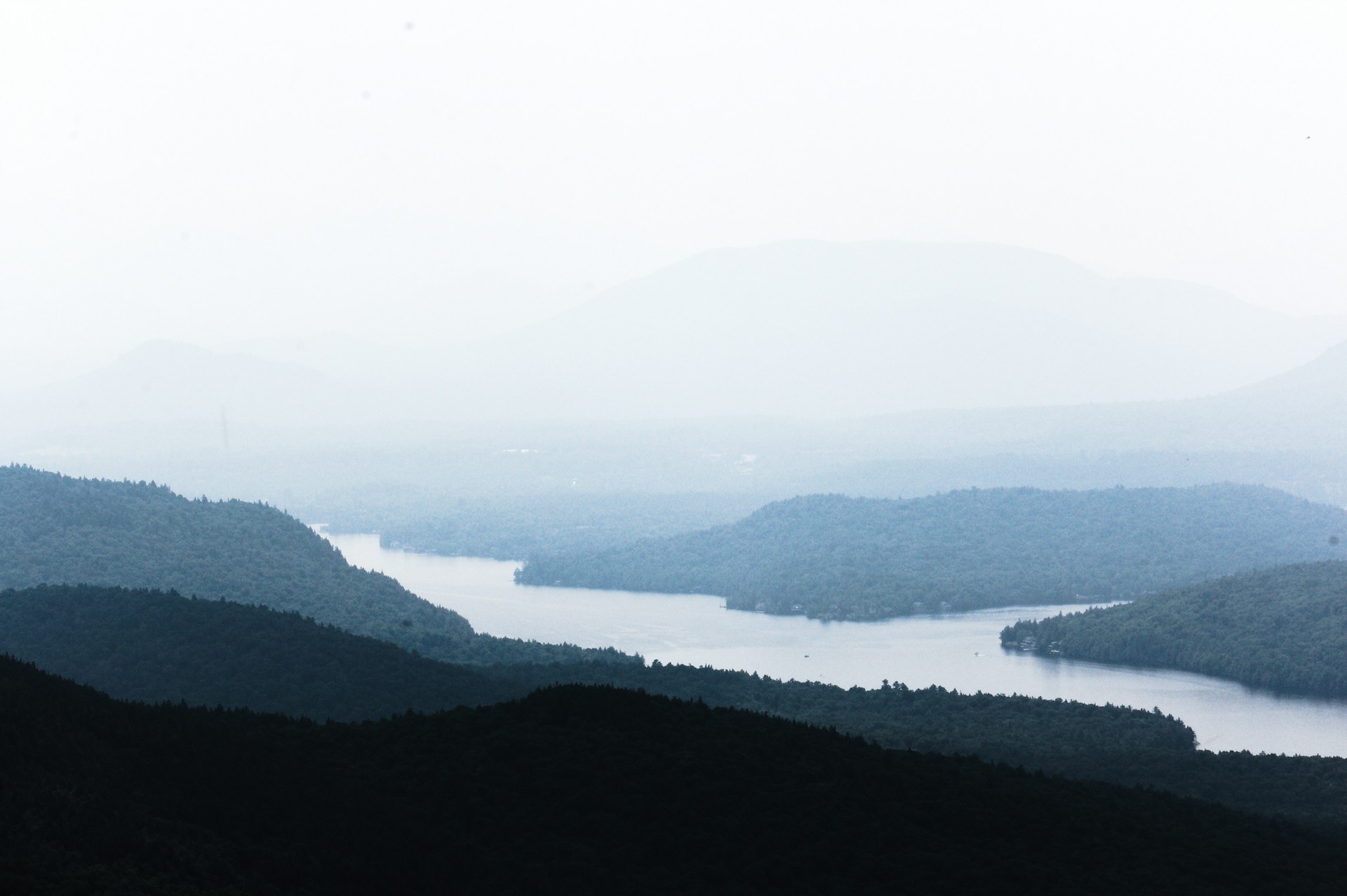 a view of a body of water surrounded by mountains