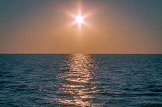 A peaceful sunset over the Kouilou region, casting golden light on the community.