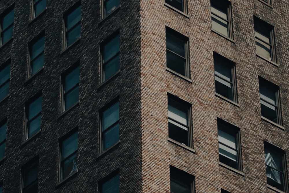 a very tall brick building with lots of windows