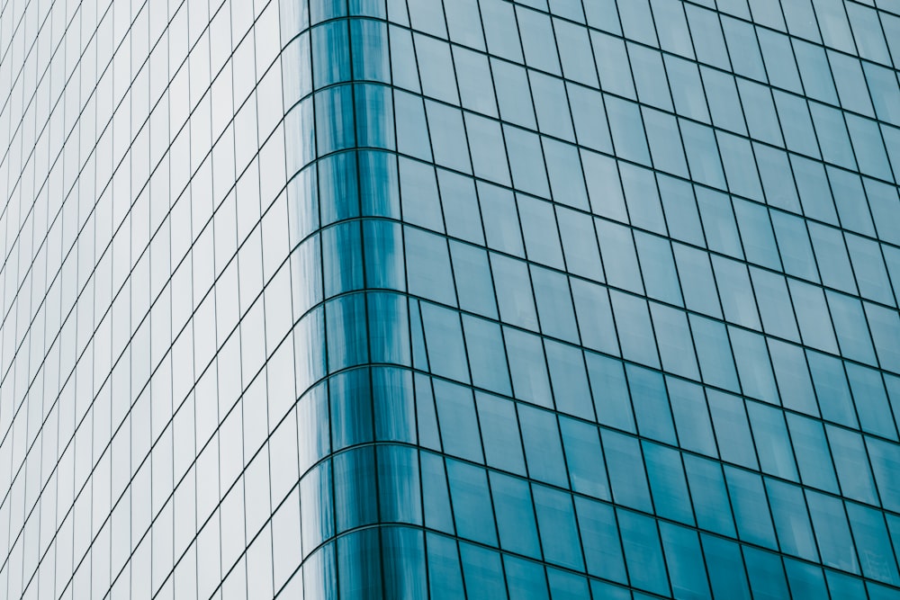 a very tall building with a blue sky in the background