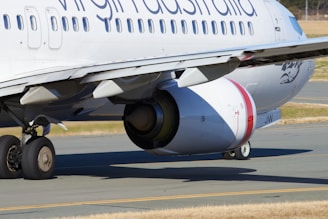 An aircraft on the runway with digital data overlays representing optimized route planning.