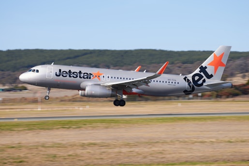 a jetliner taking off from an airport runway