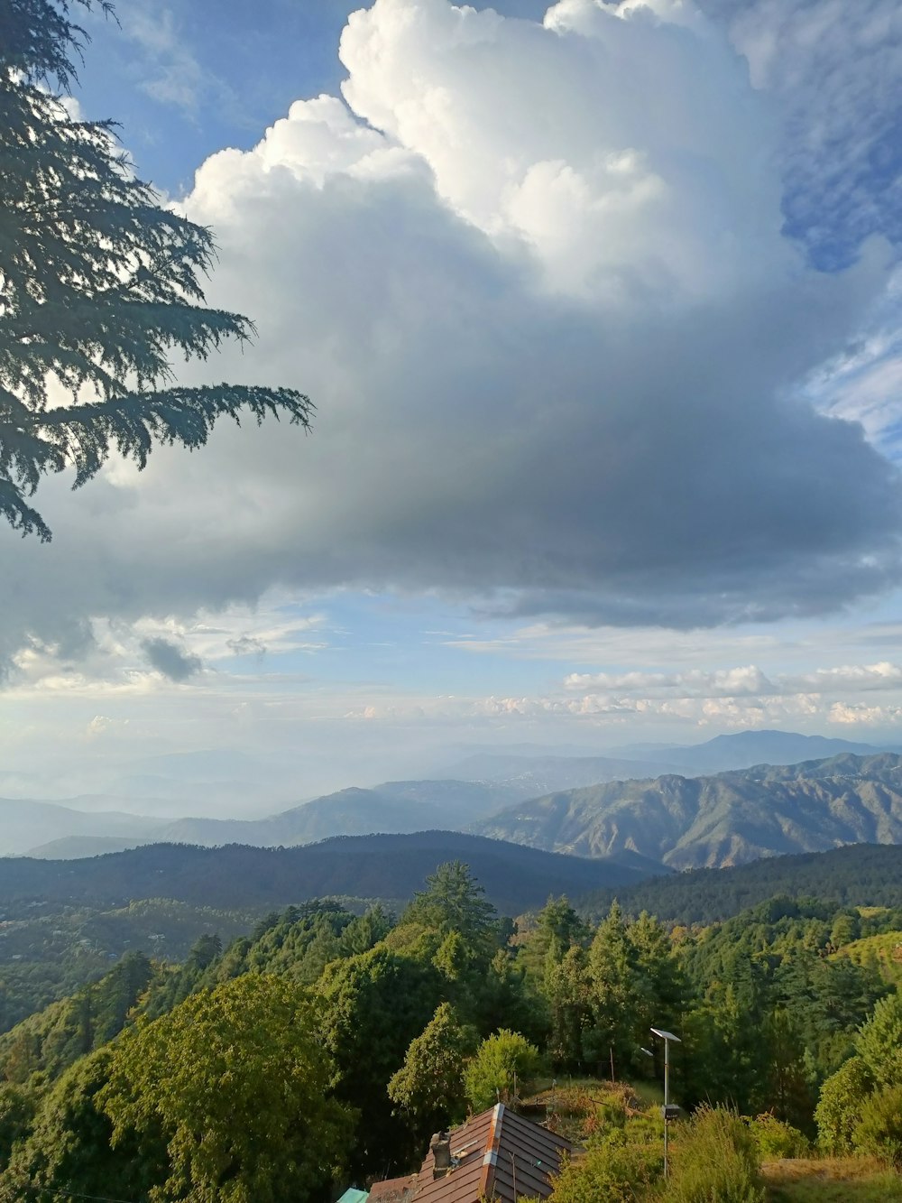 a view of the mountains from a hill top