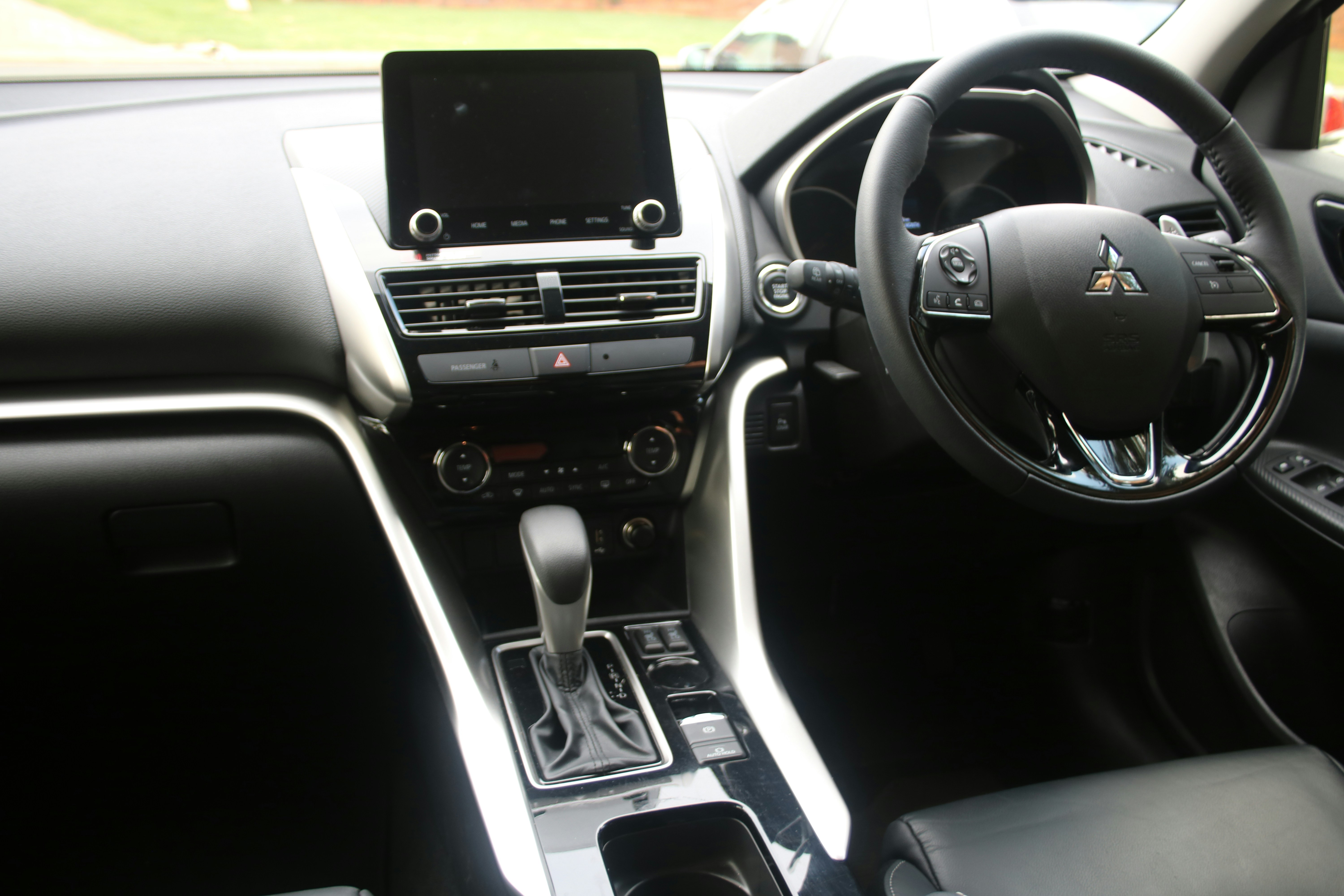 Modern Nissan Leaf electric car interior and dashboard with digital displays
