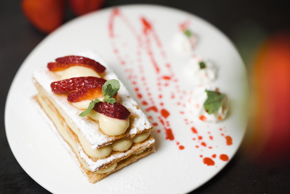 a white plate topped with a piece of cake