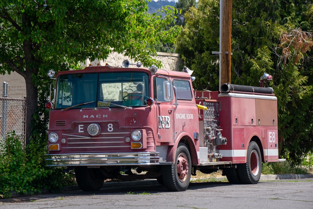 a red fire truck parked on the side of the road