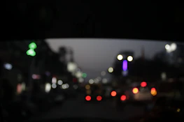 Nighttime cityscape with discreet surveillance cameras capturing activity under soft lighting.