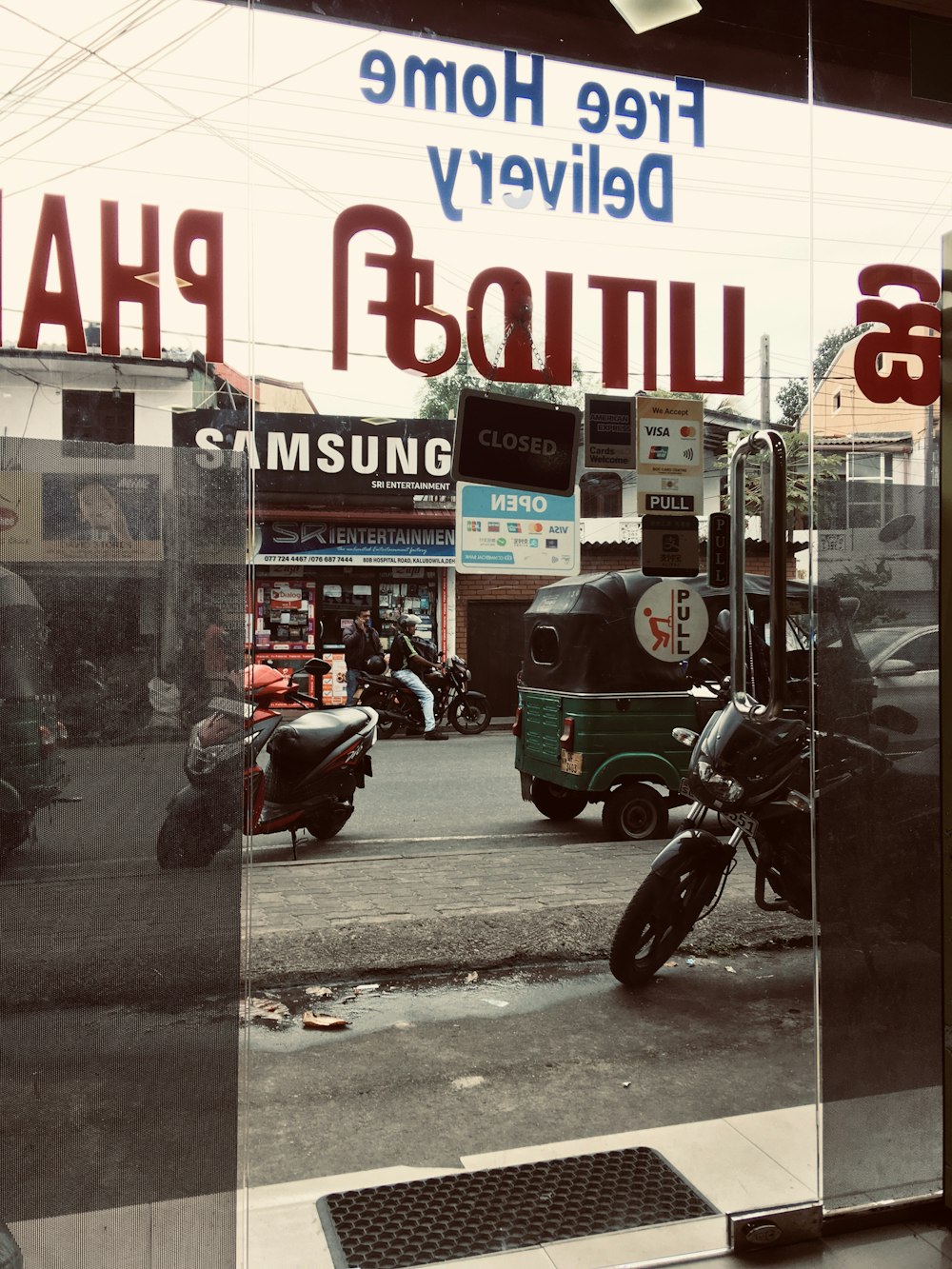 a motorcycle parked in front of a store window