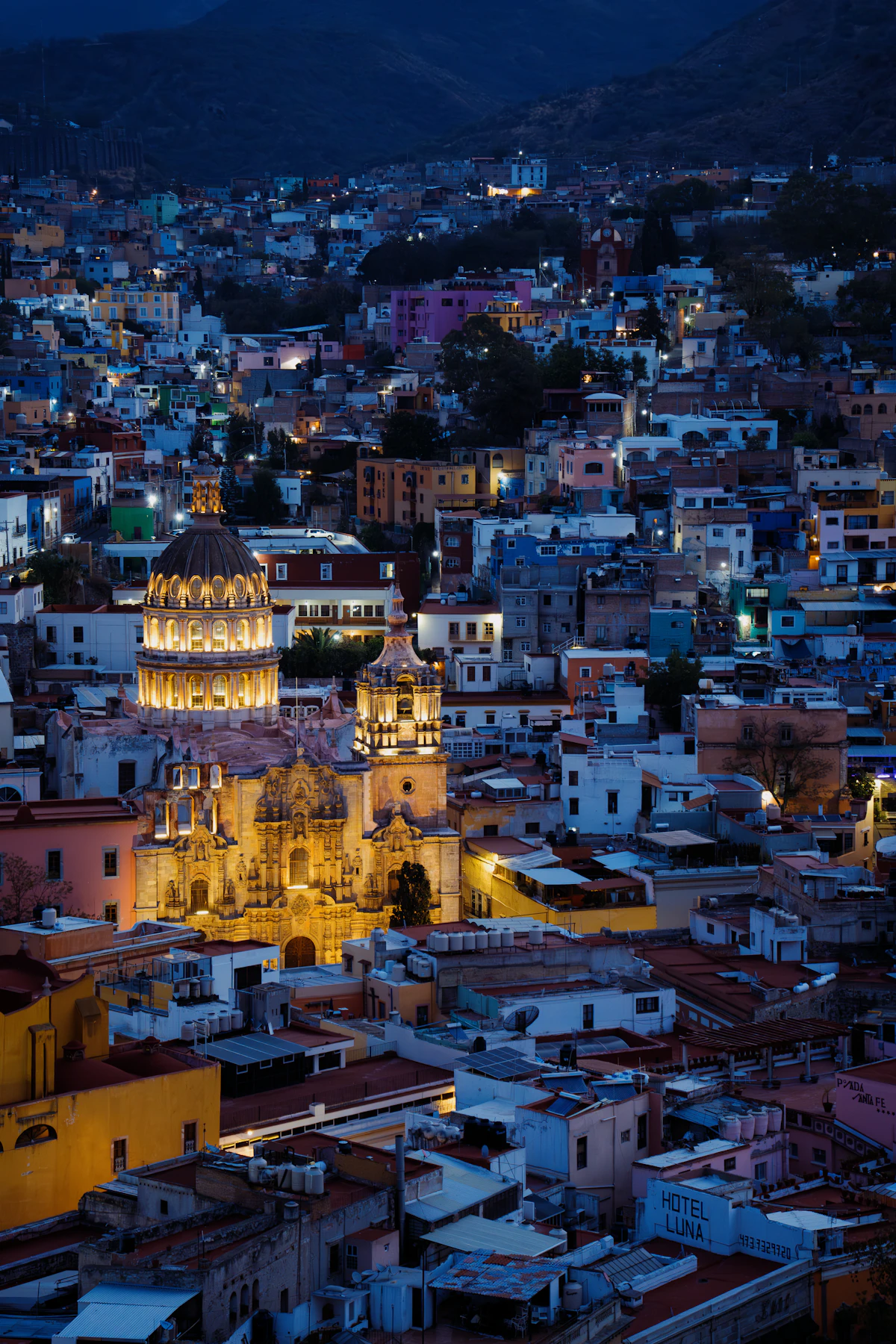 Colorful buildings of Guanajuato city under blue sky during daytime