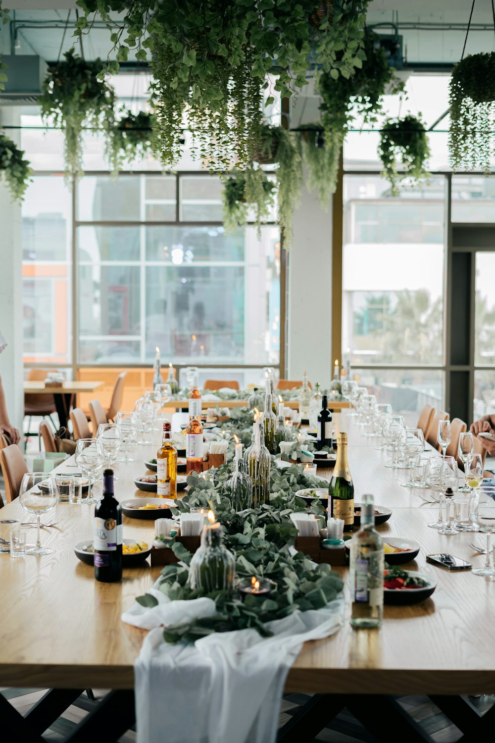 a long table with a lot of wine glasses on it
