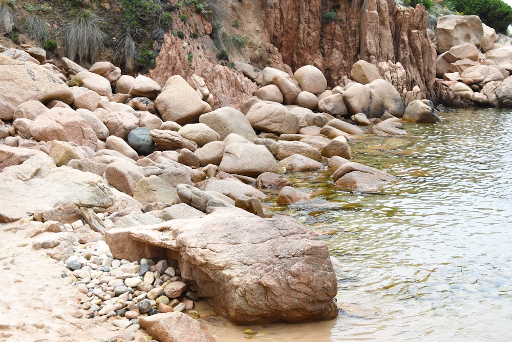 there is a large rock in the middle of the water