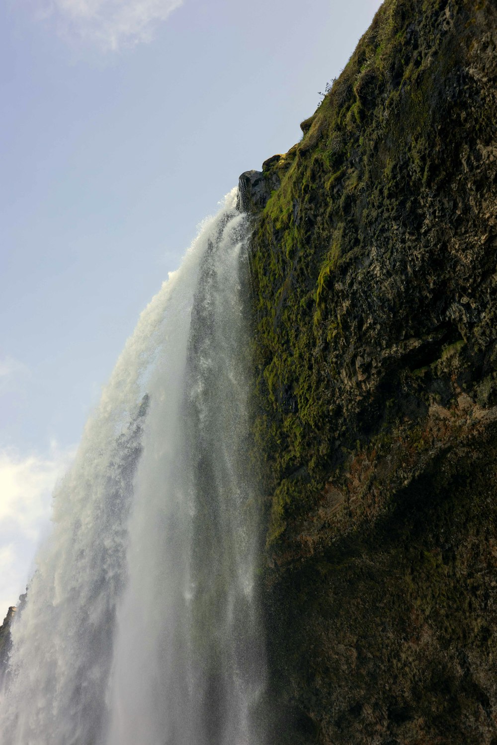 a large waterfall that is falling down into the water