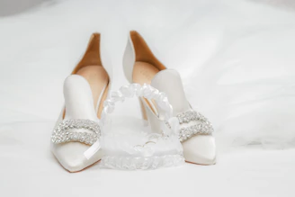 A luxurious set of elegant stockings and garters displayed on a velvet surface.