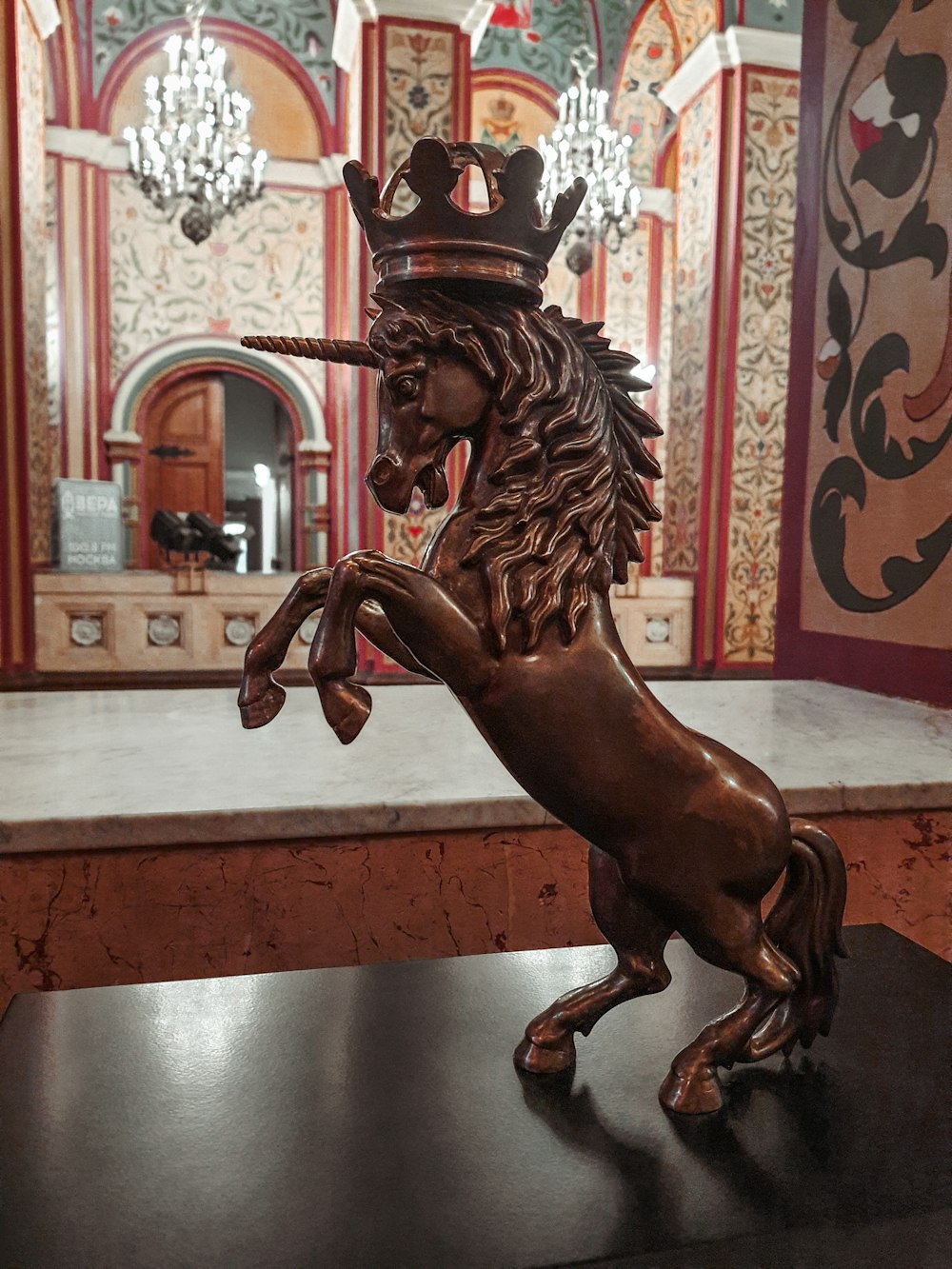 a statue of a horse with a crown on its head
