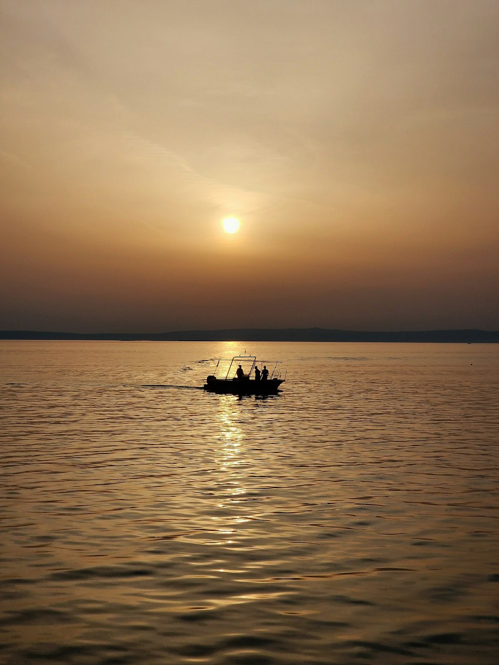 a couple of people on a small boat in the water