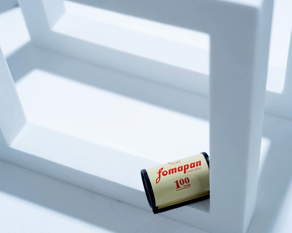 a small battery sitting on top of a white chair