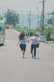 A young couple holding hands, relieved and happy after relationship coaching.