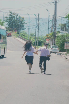 A young couple holding hands, relieved and happy after relationship coaching.