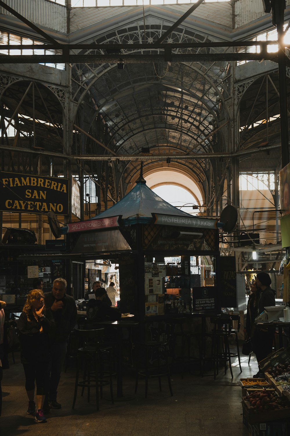 a group of people standing inside of a building