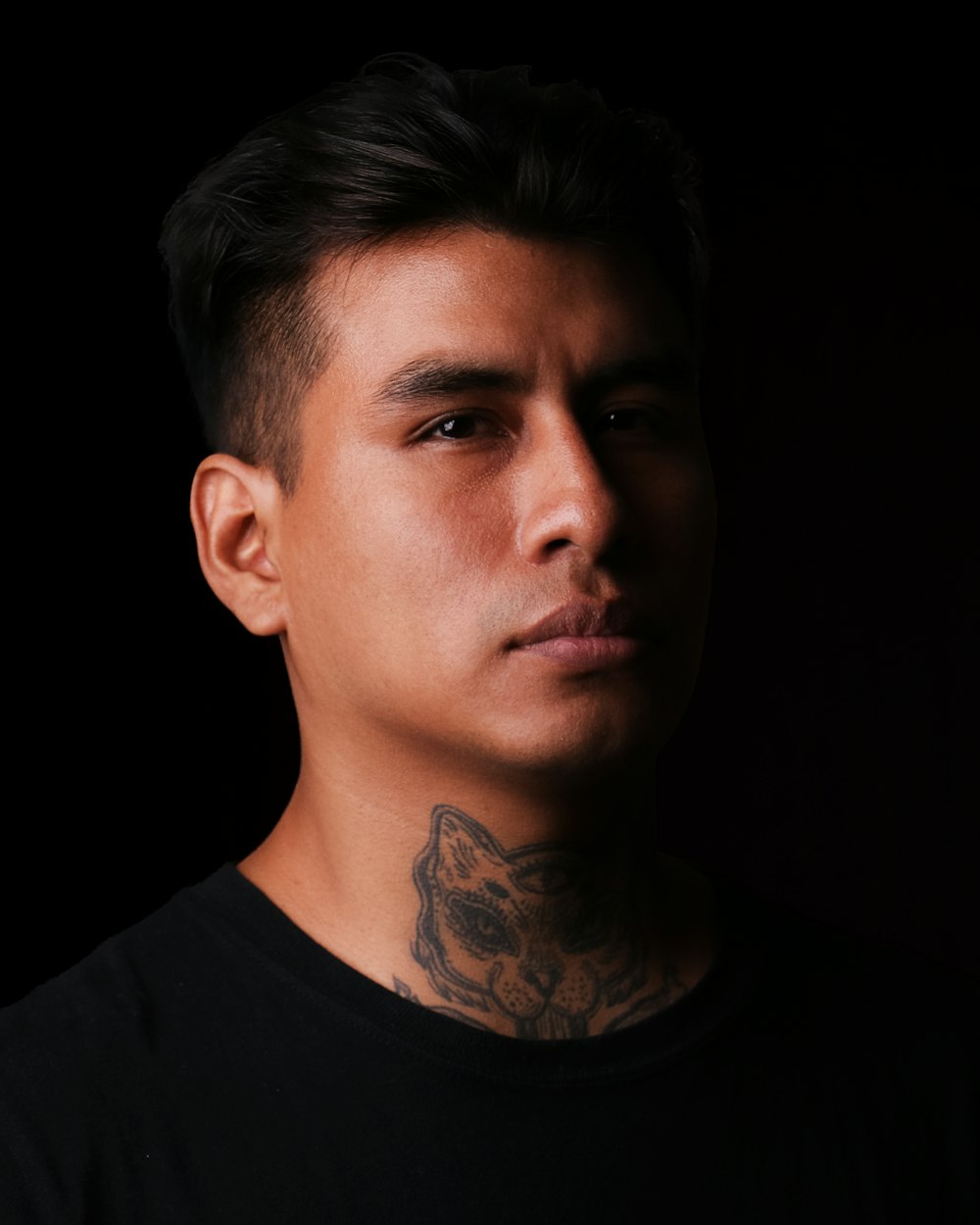 a man with a tattoo on his neck