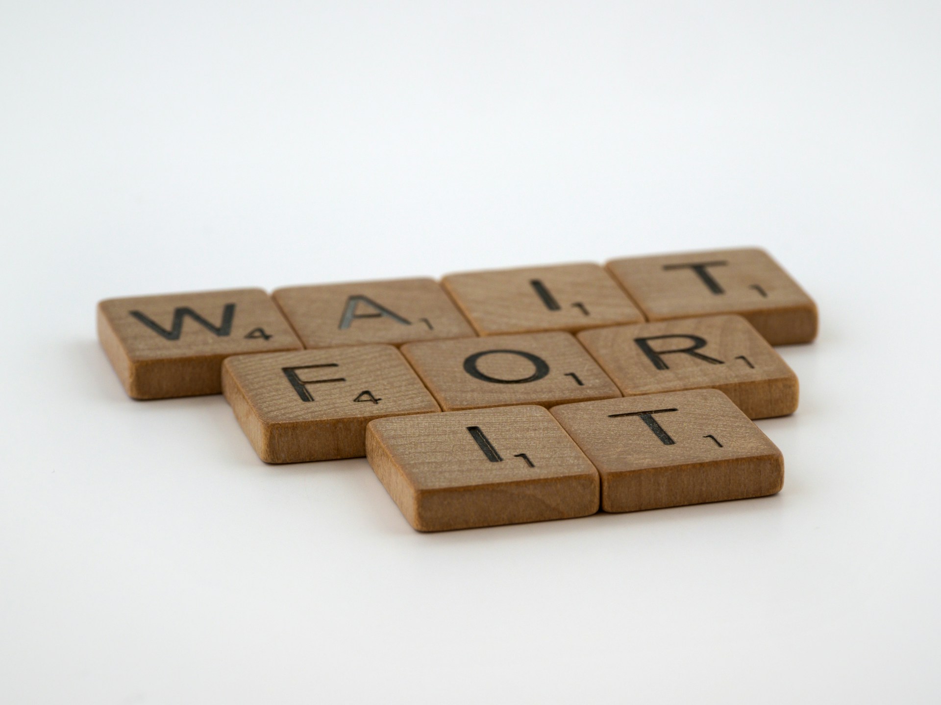 a scrabble of words that spell out wait for it