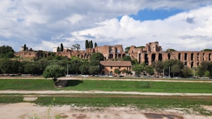 a large building sitting on top of a lush green field