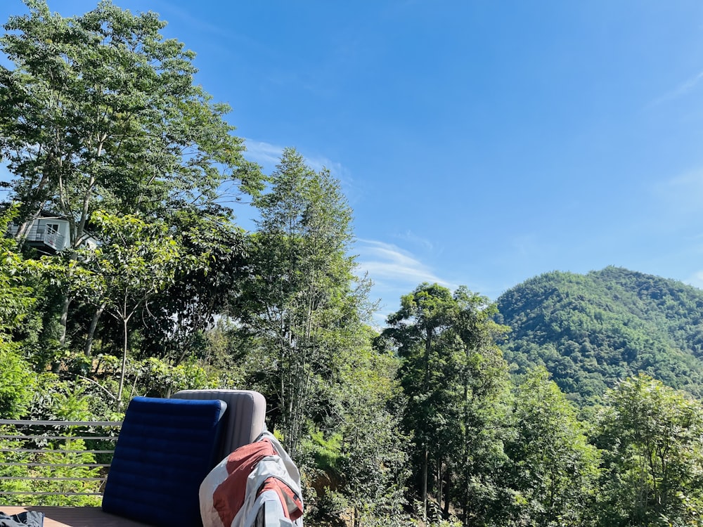 a blue chair sitting on top of a wooden deck