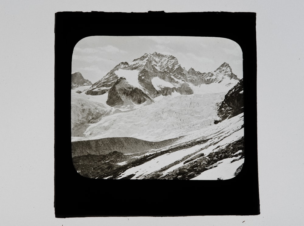 a black and white photo of a mountain range