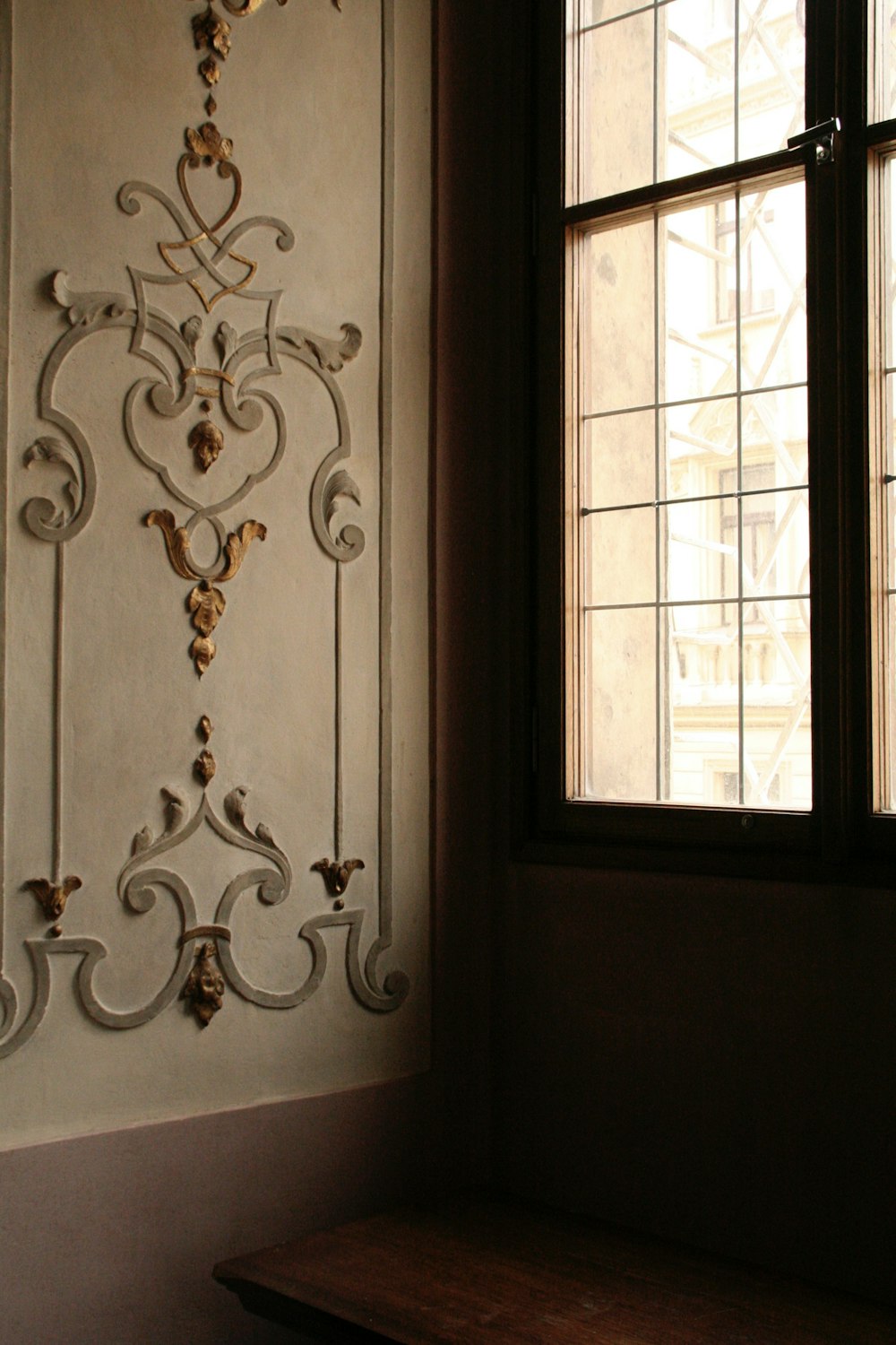 a window and a bench in a room